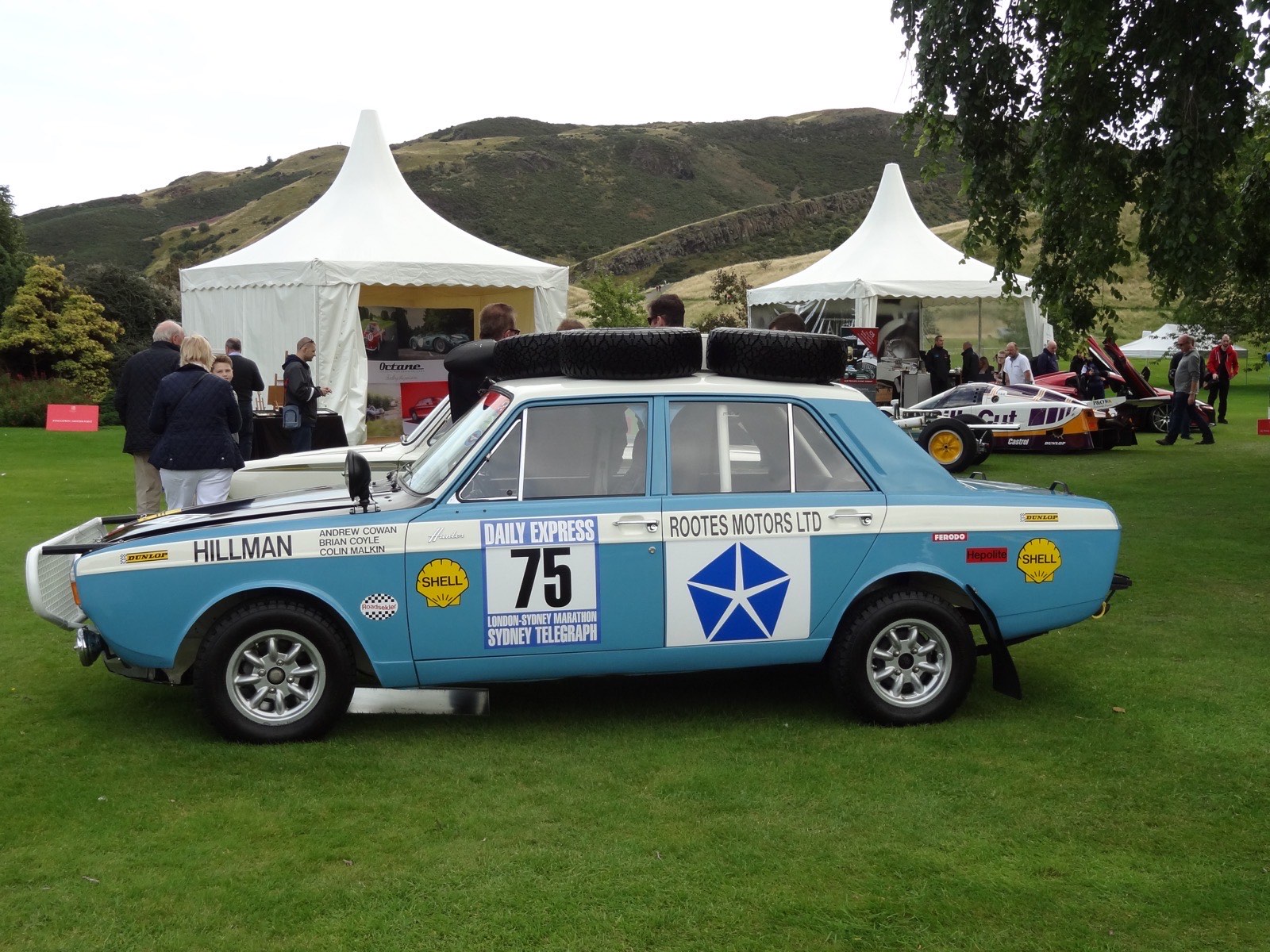 The winning Hillman Hunter, car 75 of Andrew Cowan, Brian Coyle and Colin Malkin, in Daily Express–Sydney Telegraph Marathon livery at a show in 2015. The Lancers' Land Rover, car 99, finished 49th in the same event.