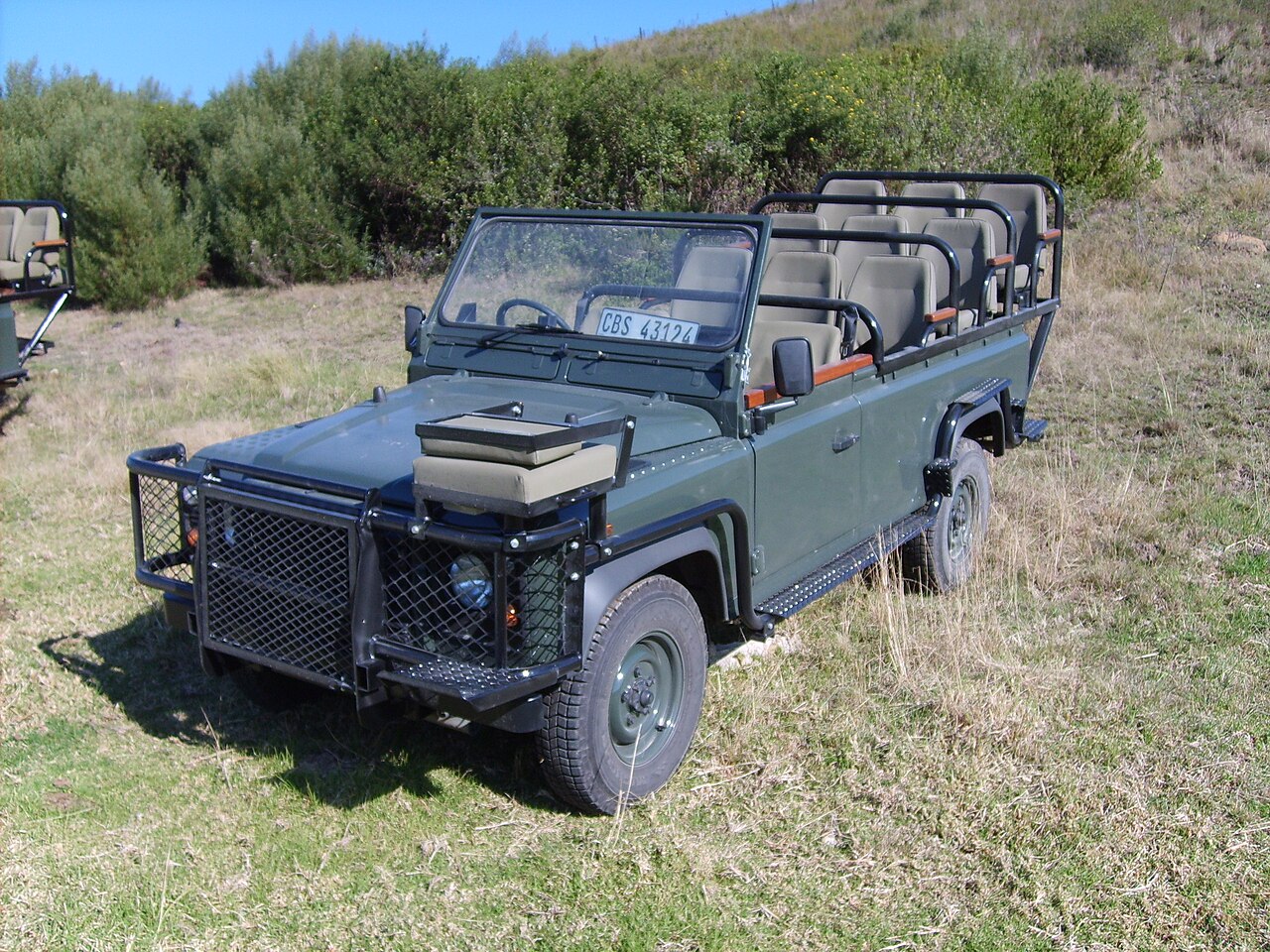 Defender 130 Safari — Long-wheelbase open Land Rover Defender game viewer with tiered seating at Gondwana Game Reserve, South Africa — the same conversion type as this record, not the catalogue's vehicle