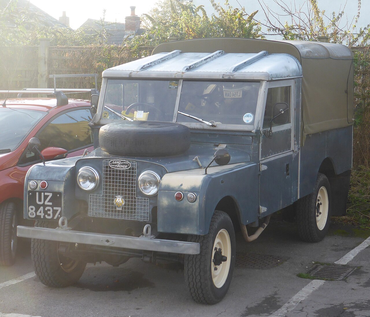 Series I 109″ — 1957 Land Rover Series I 109-inch truck cab with canvas-tilt rear