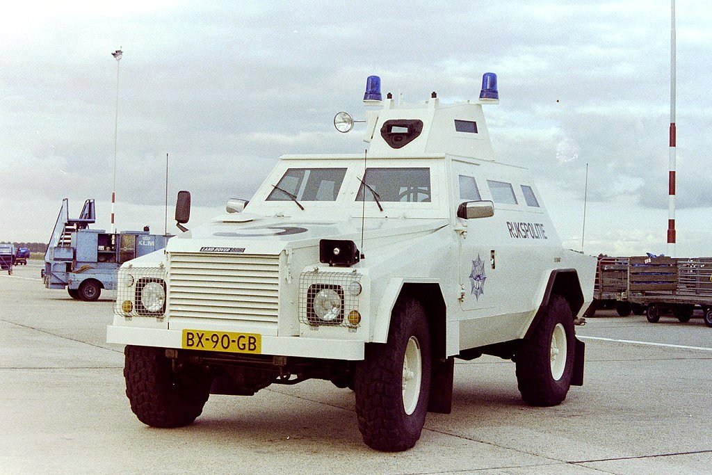 Shorland Mk 4 APC — Shorland armoured patrol car of the Dutch aviation police at Amsterdam Airport, 1991. No free photograph of a confirmed Mark 4 was found: this is a later coil-sprung Defender 110-based Series 5 car, the generation that replaced the Mark 4.